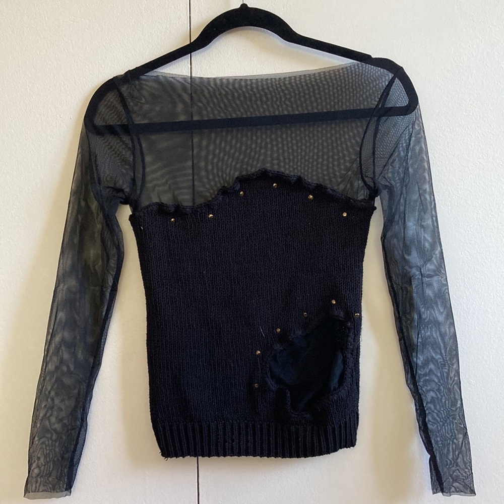 A-symmetrical black knit top with mesh sleeves and panel